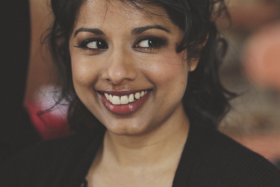 Smiling woman looking sideways in warm light