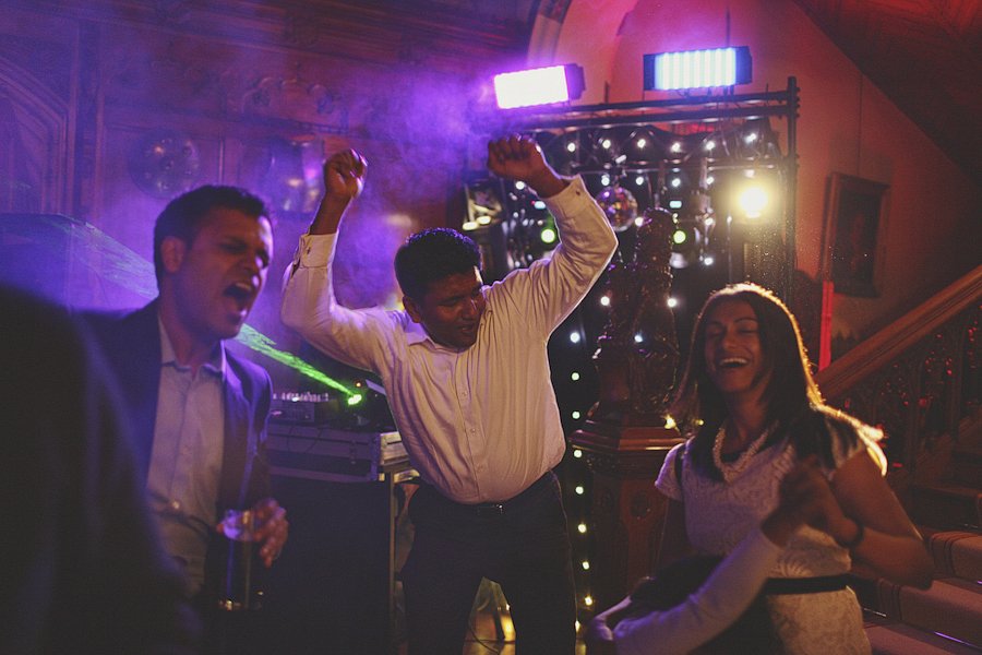Friends dancing at colorful indoor party
