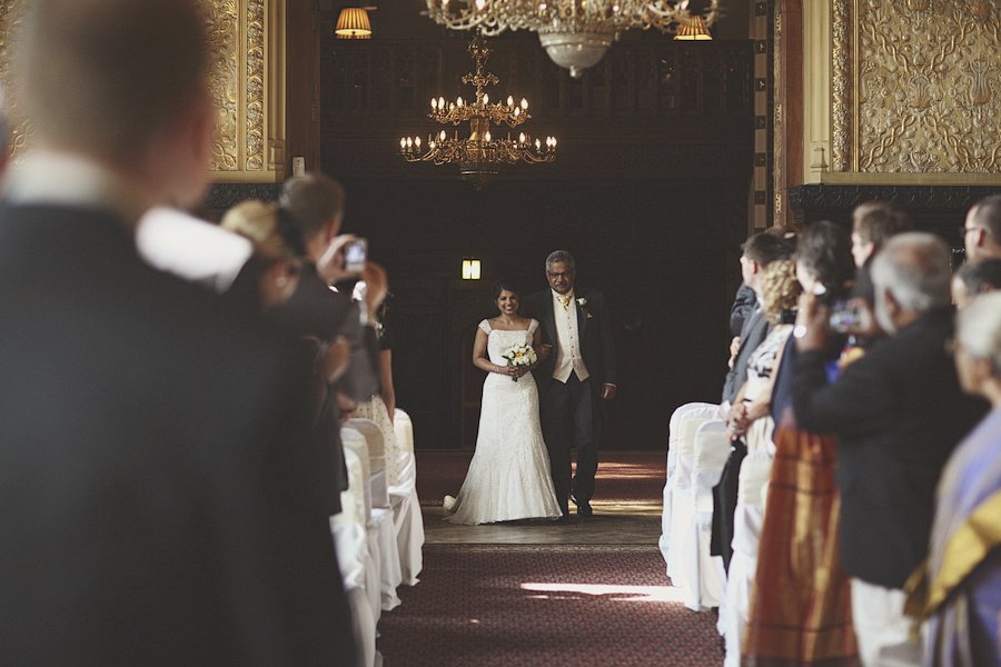 Bride walking down aisle with father