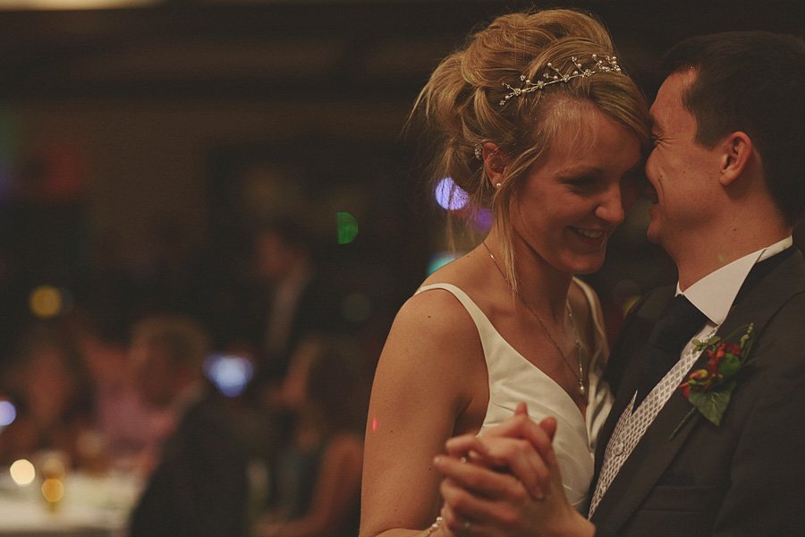 Bride and groom sharing first dance at reception