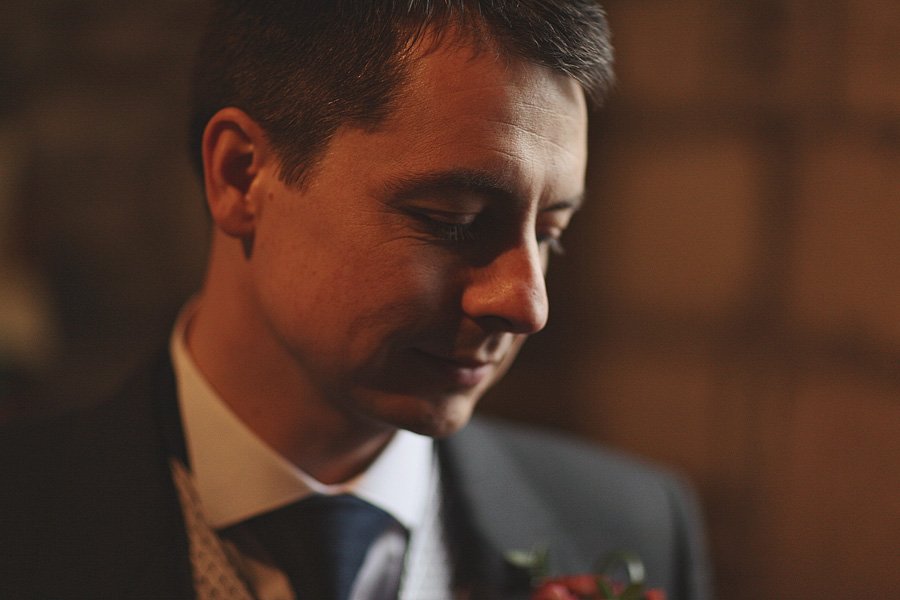 Man in suit with boutonniere, soft lighting
