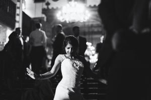 Woman dancing at formal event in black and white