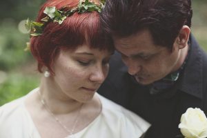 Couple sharing intimate moment with white rose