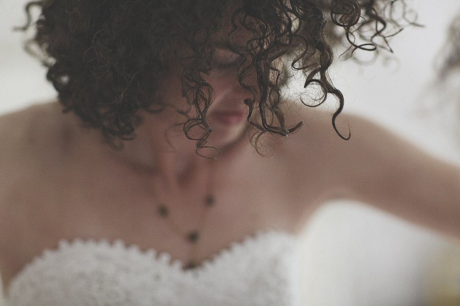 Close-up of person with curly hair and towel