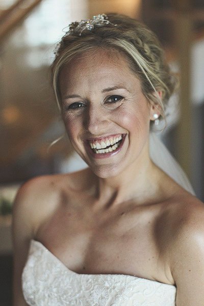 Smiling bride in strapless wedding dress