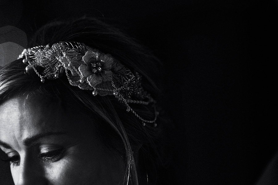 Black and white portrait of woman with floral headpiece