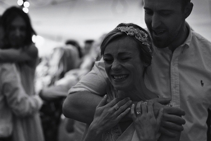 Man embracing smiling woman at celebration