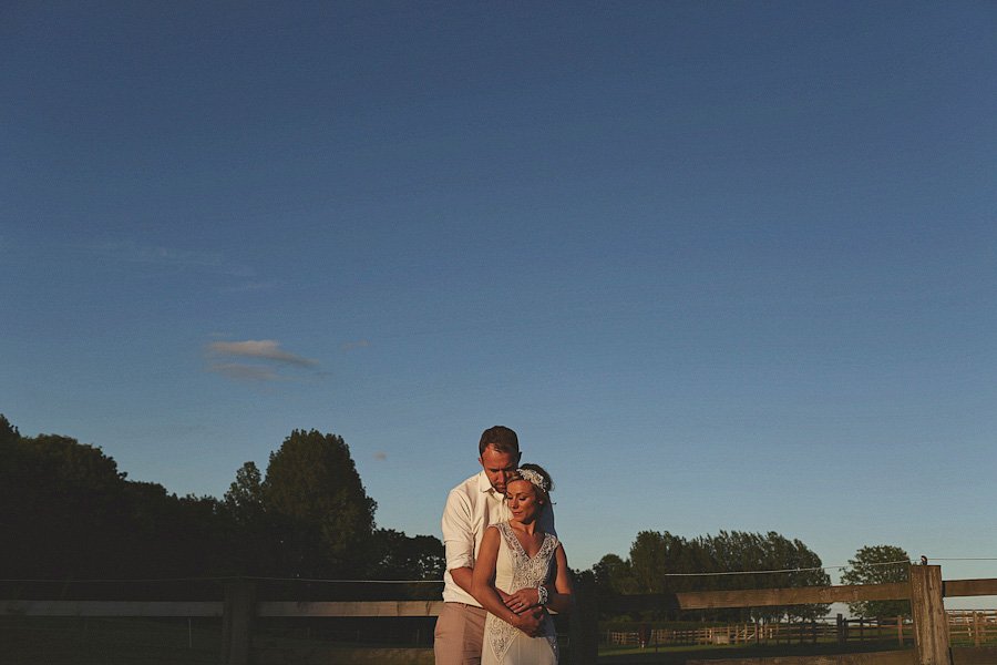 Couple embracing outdoors at sunset