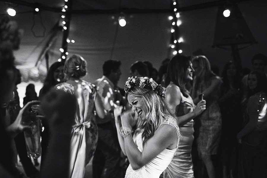 Woman with flower crown dancing at party