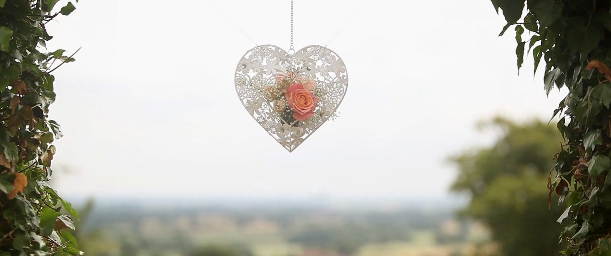 Heart-shaped floral ornament hanging outdoors