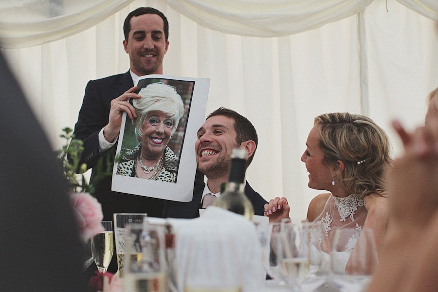 Wedding speech with man holding photo