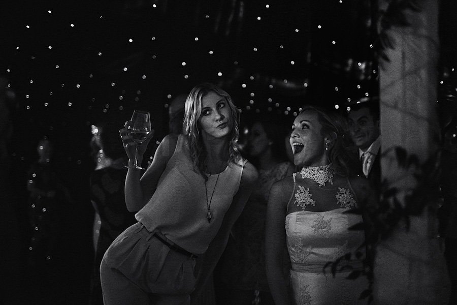 Two women dancing at a wedding reception