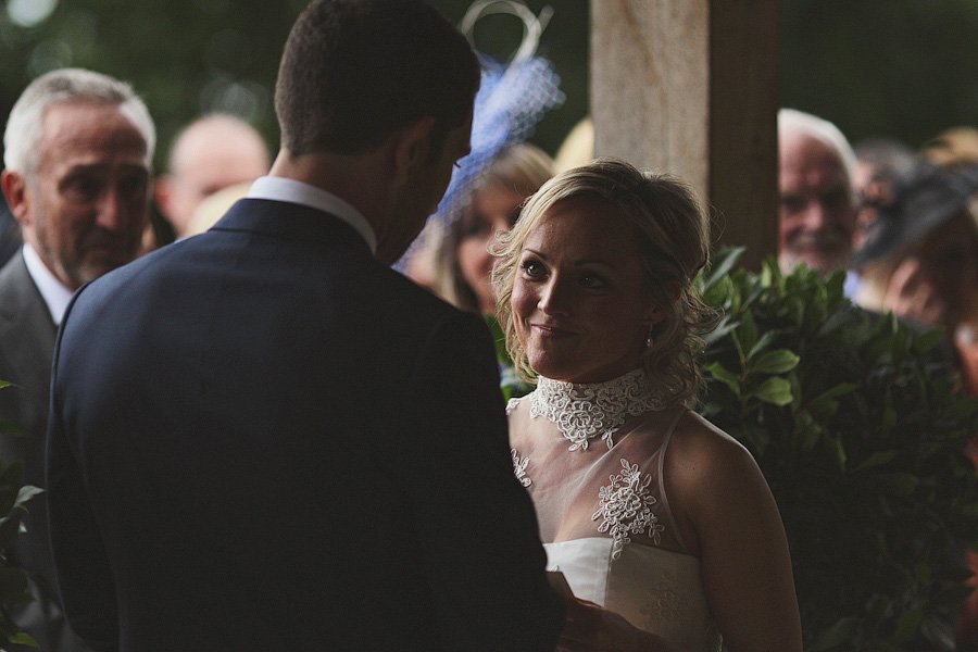 Bride and groom exchanging vows at wedding ceremony