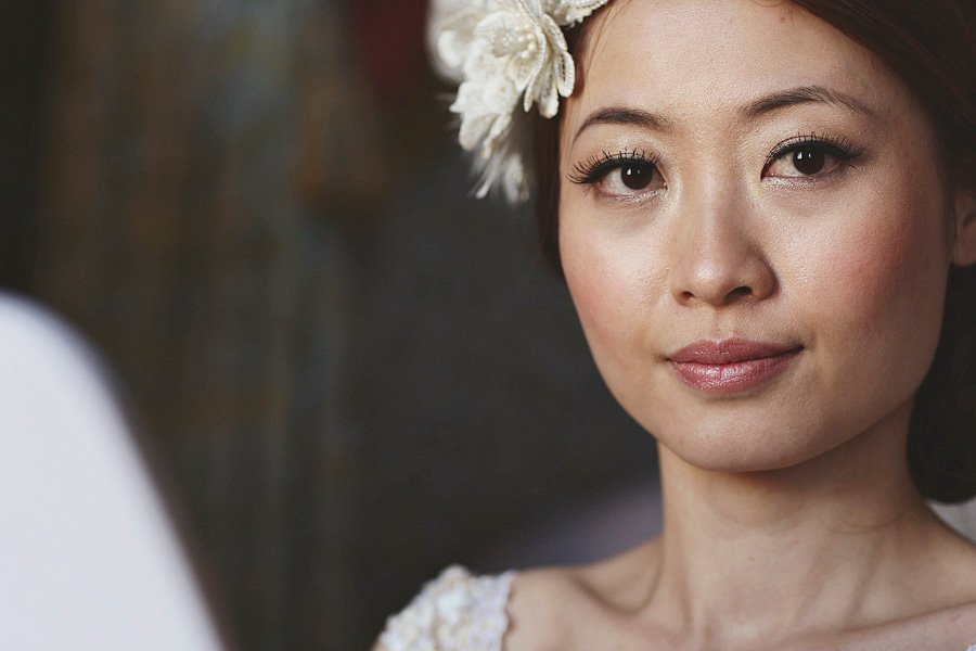Close-up portrait of woman with floral headpiece