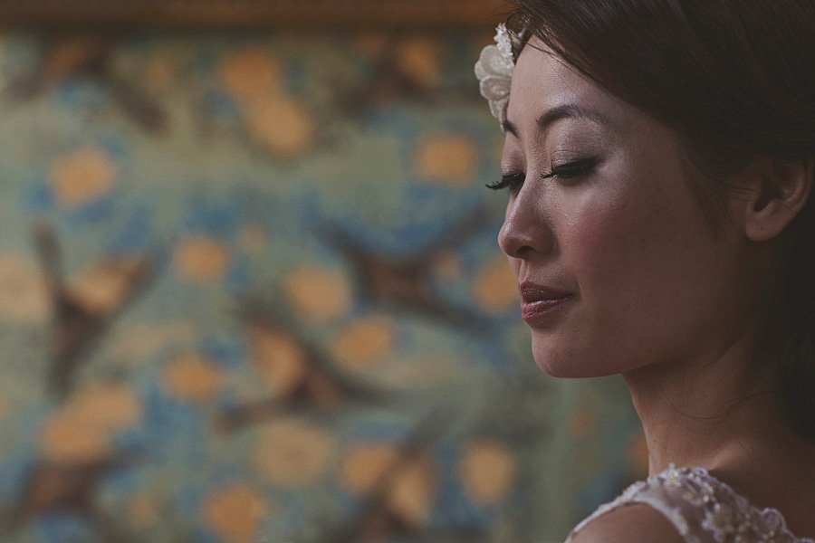 Close-up profile of woman with flower in hair