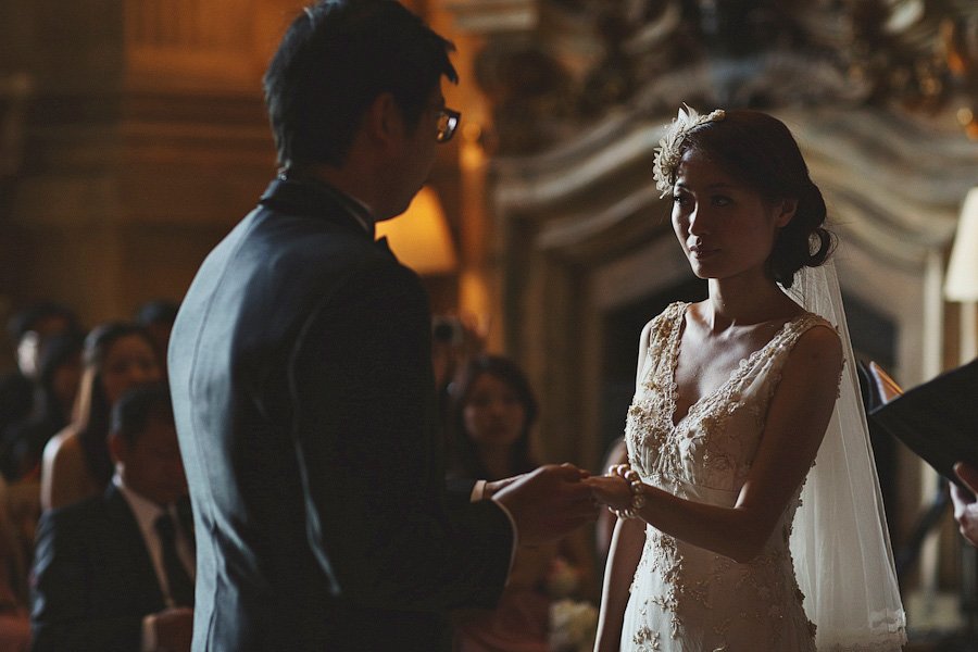 Bride and groom exchanging rings during wedding ceremony