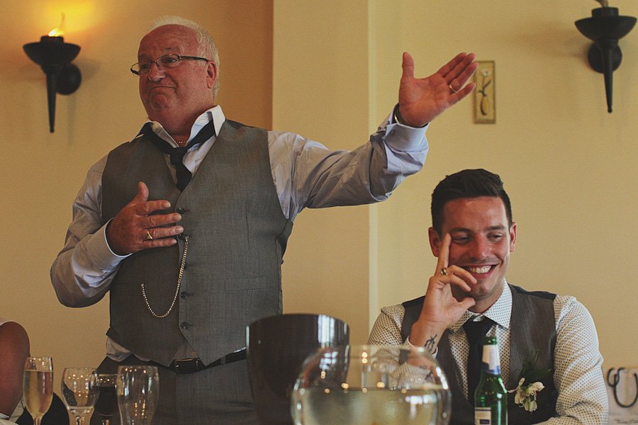 Man giving heartfelt speech at wedding reception