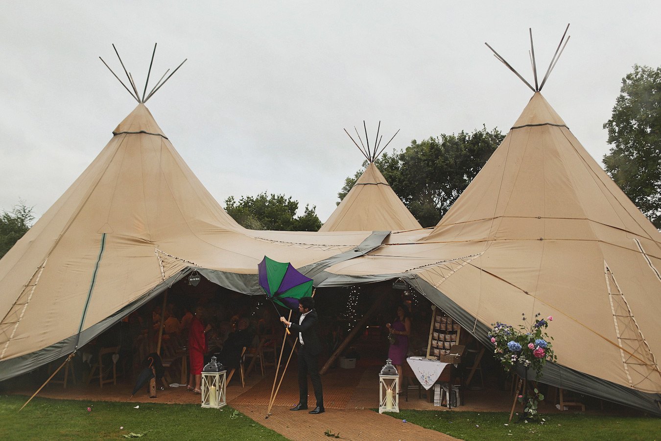 Large outdoor teepee tents set up for event