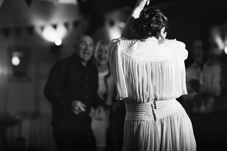 Woman dancing in flowing dress, black and white