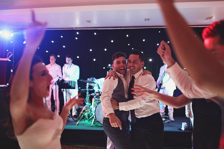 Guests dancing at wedding reception with live band