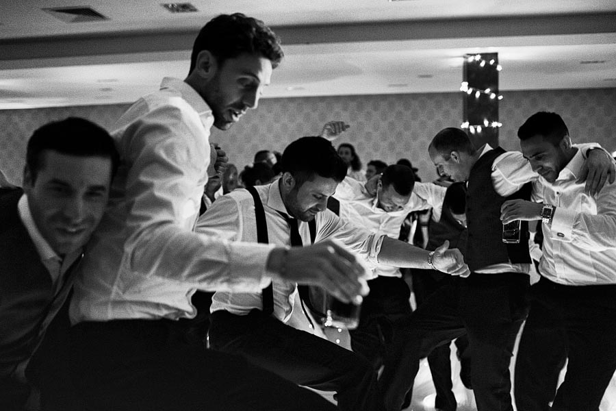 Men dancing together at a lively party