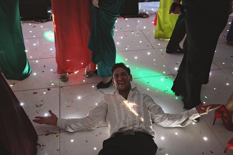 Man lying on dance floor at party