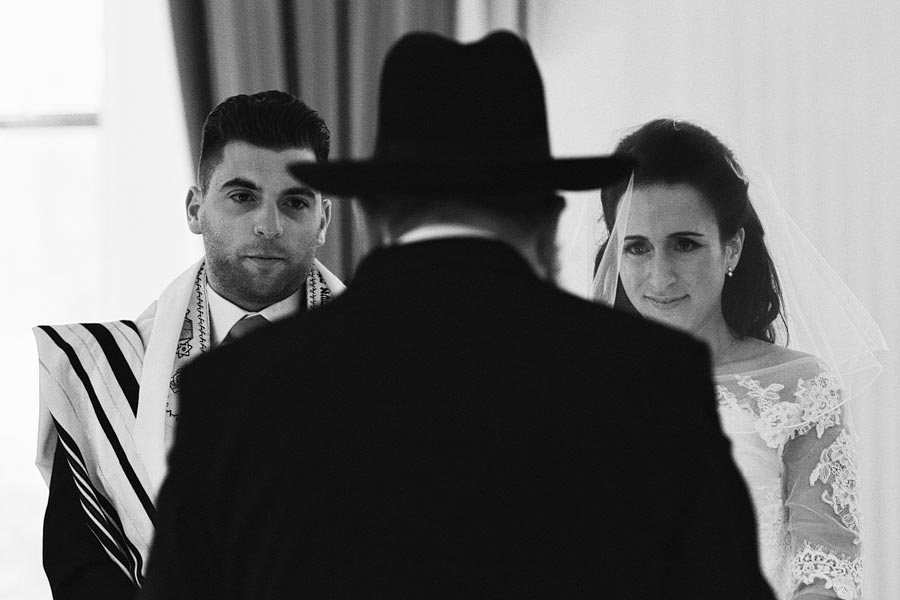 Bride and groom during traditional Jewish wedding ceremony
