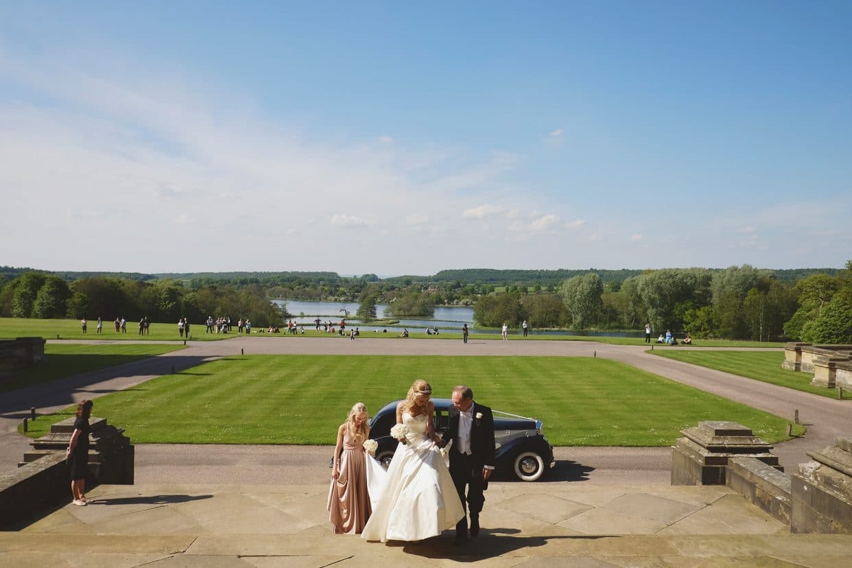 Bride and dad heading to ceremony at Castle Howard