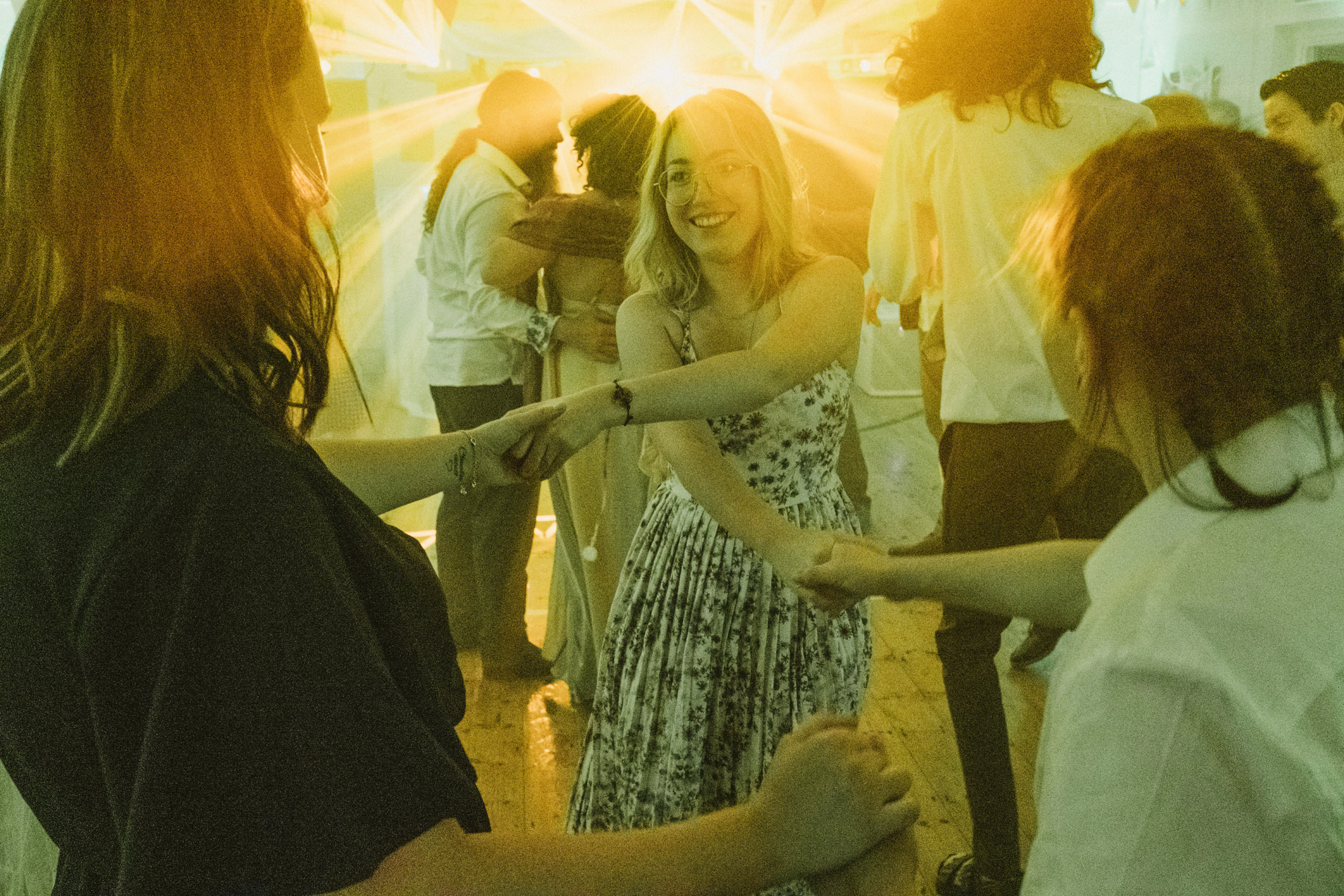 People dancing happily at a lively celebration.