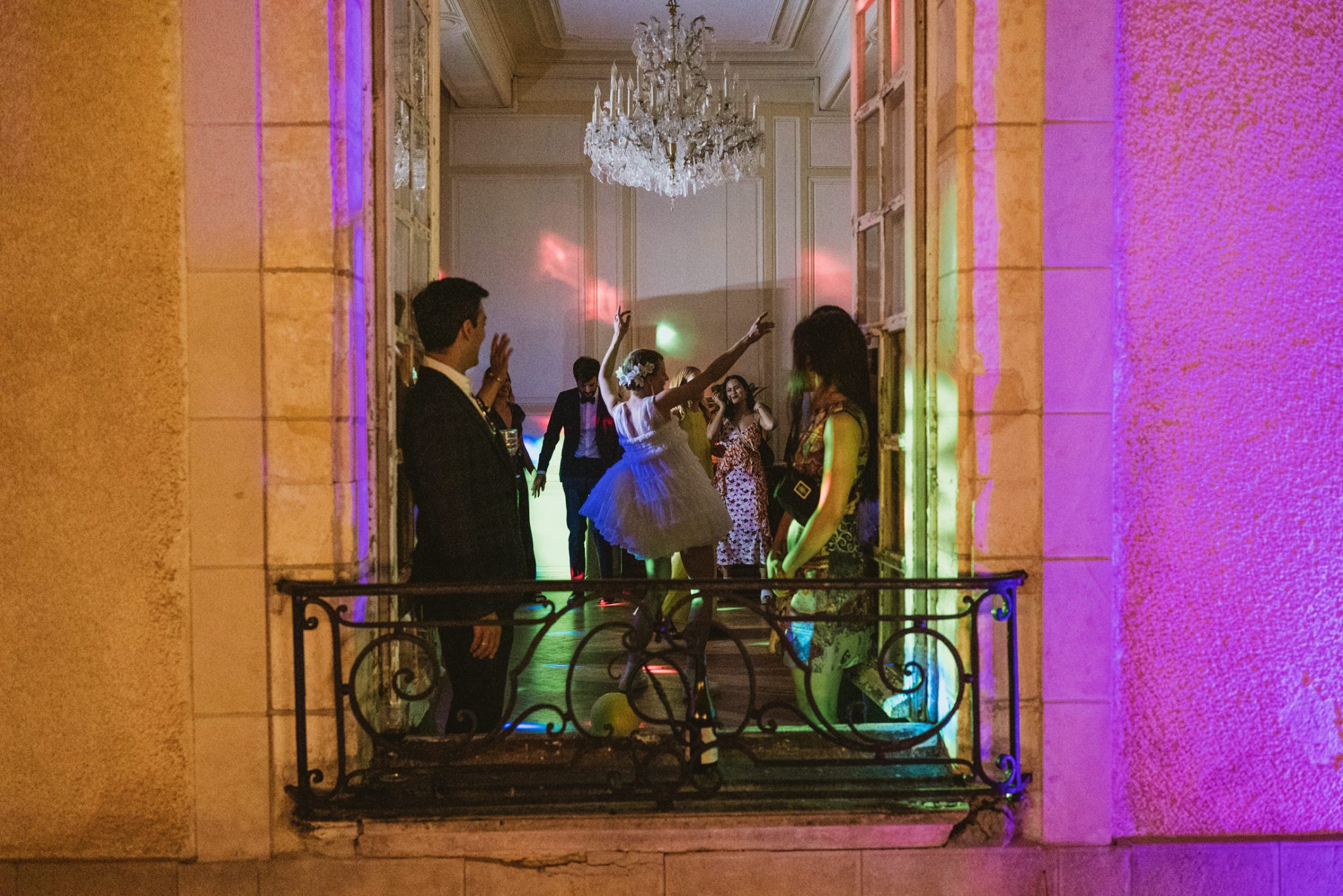 From outside the window of the Chateau du Fey, the bride dances