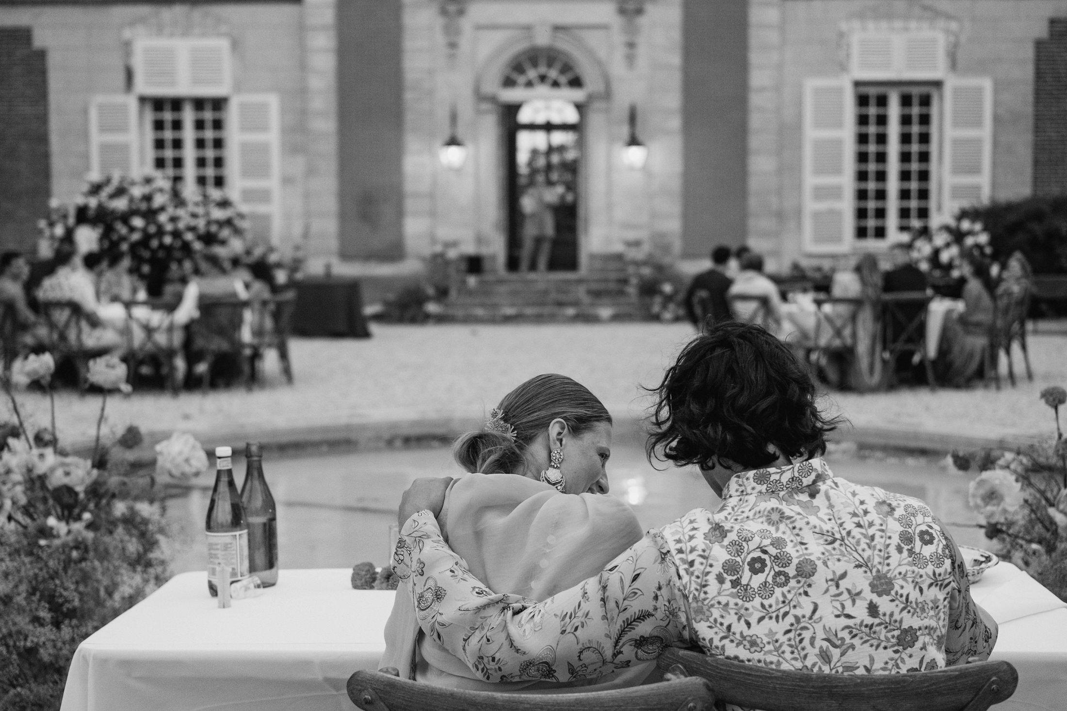 Bride and groom hug together at the speeches at the Chateau du Fey in France
