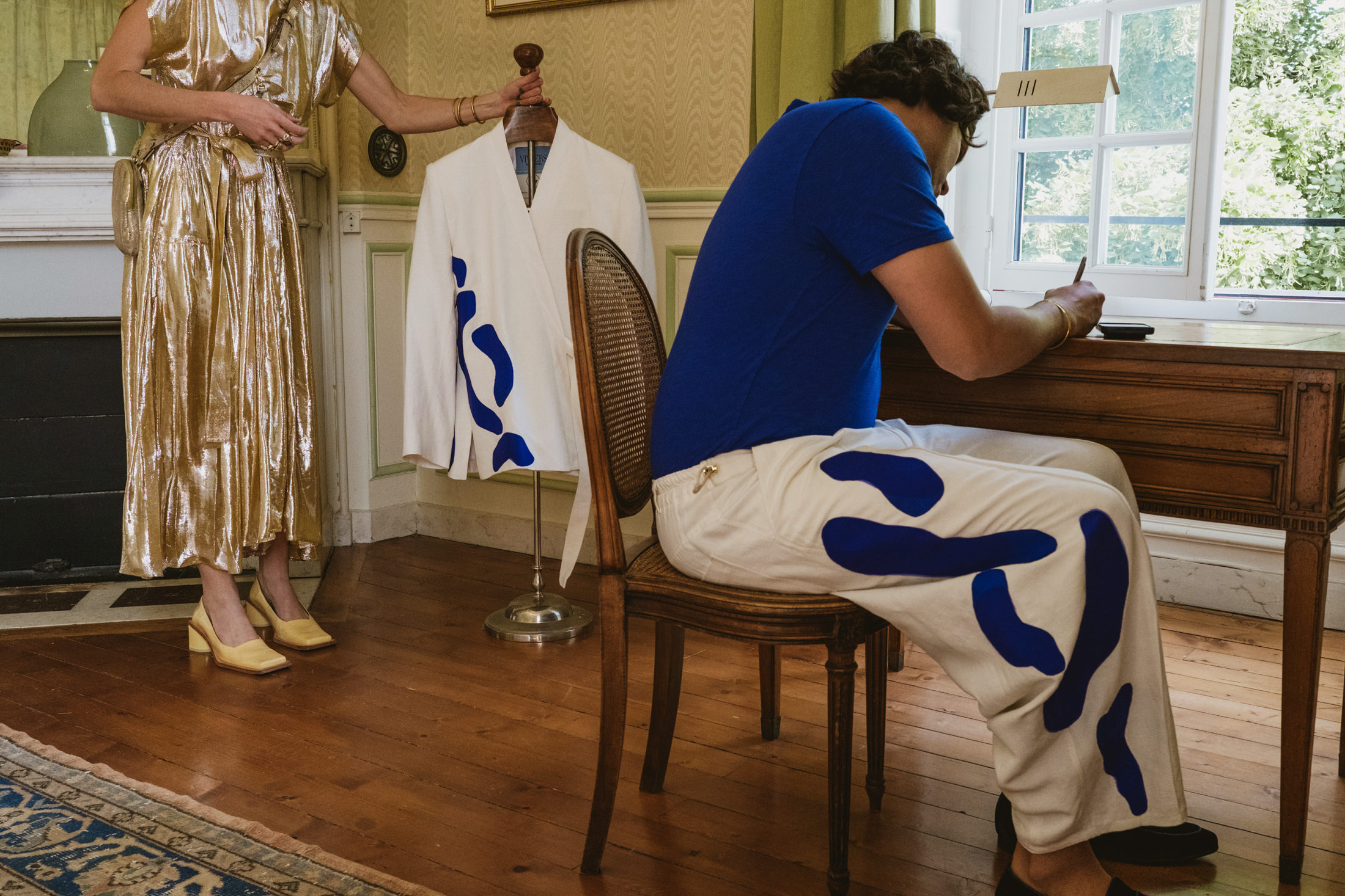 groom getting ready in his room at Chateau du Fey, writing his speech