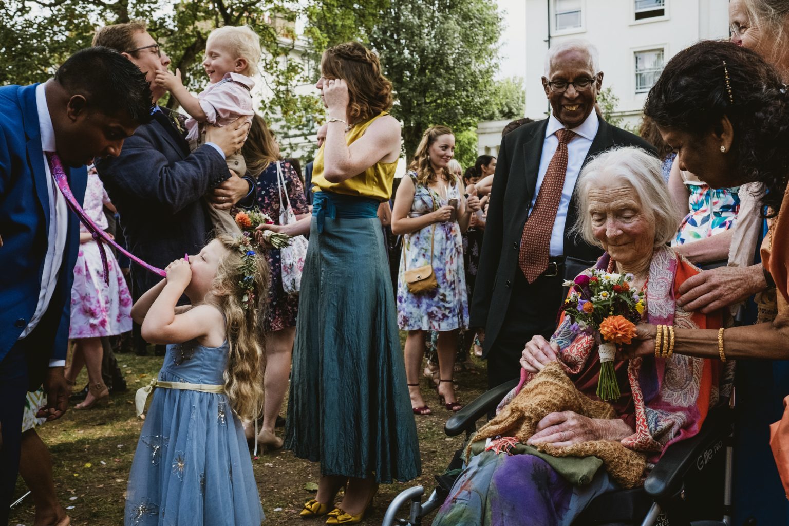 layered, street-style wedding reception photograph featuring multiple guests and combined mini-scenes of action