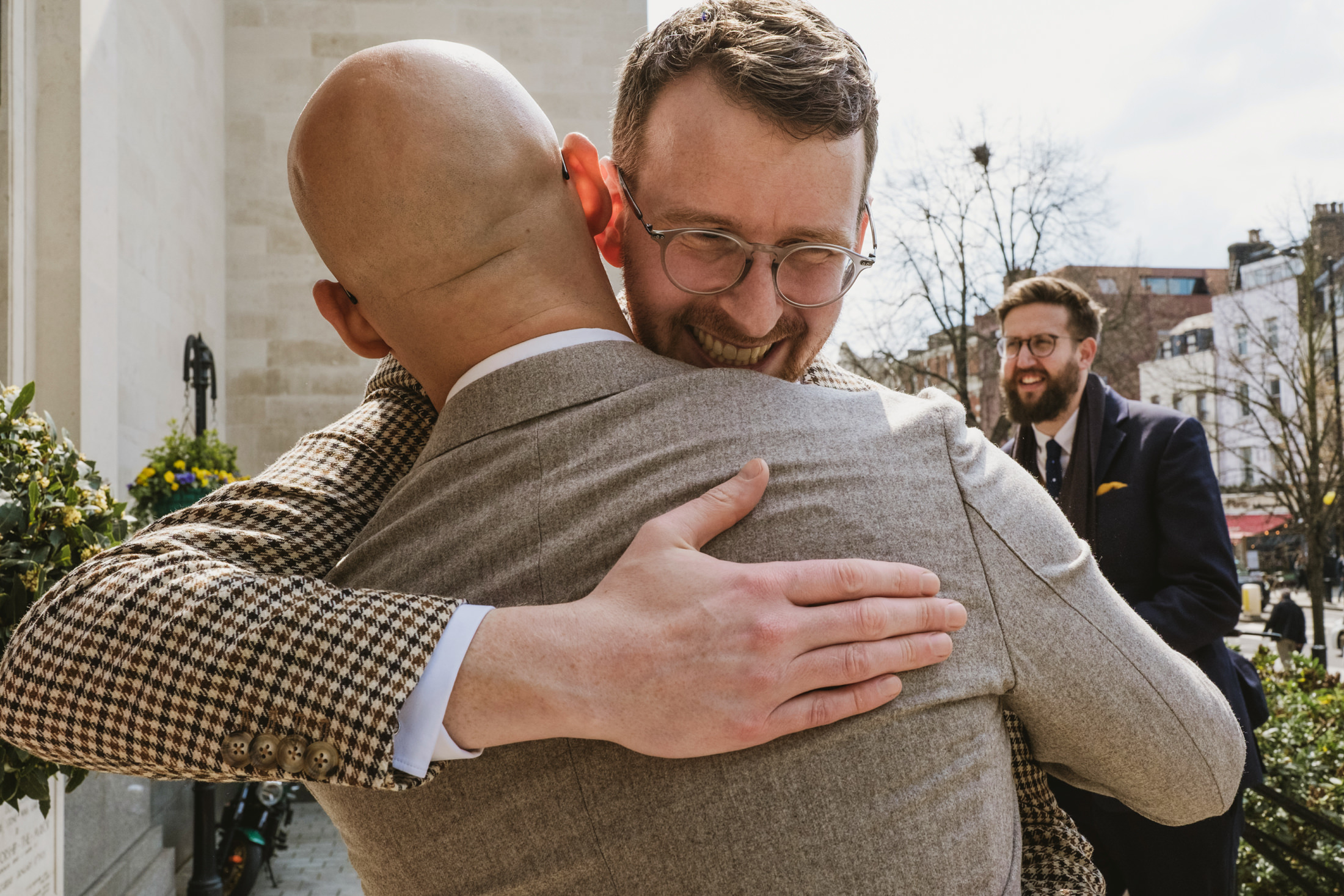 Two men hugging at outdoor event