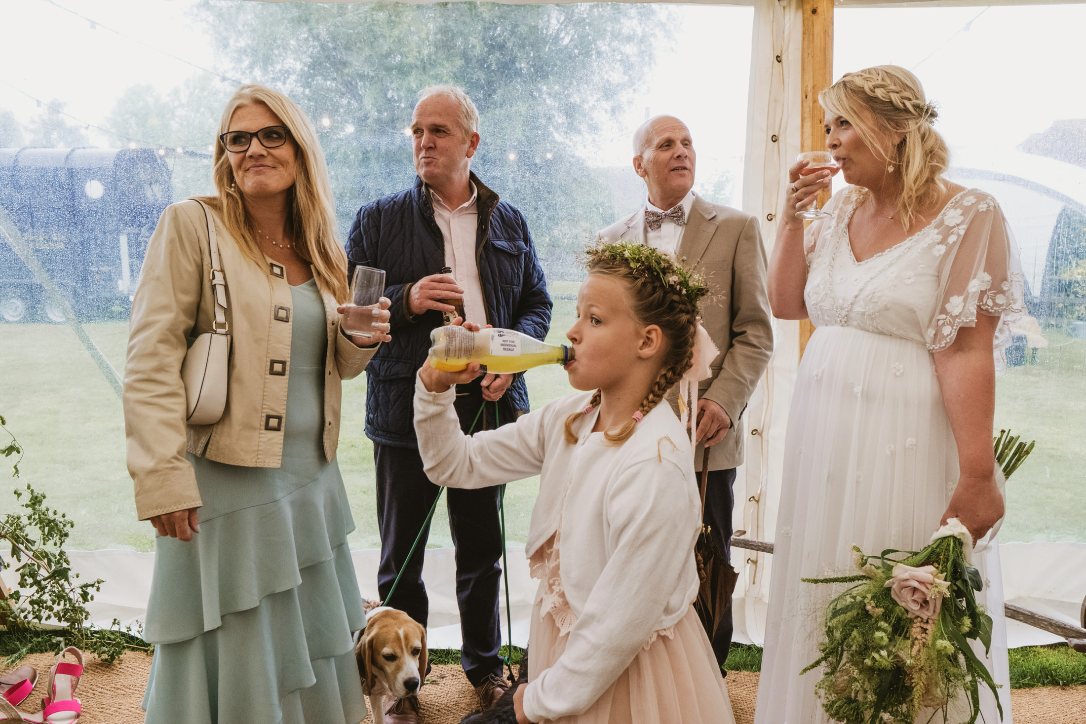 Wedding guests and girl drinking juice