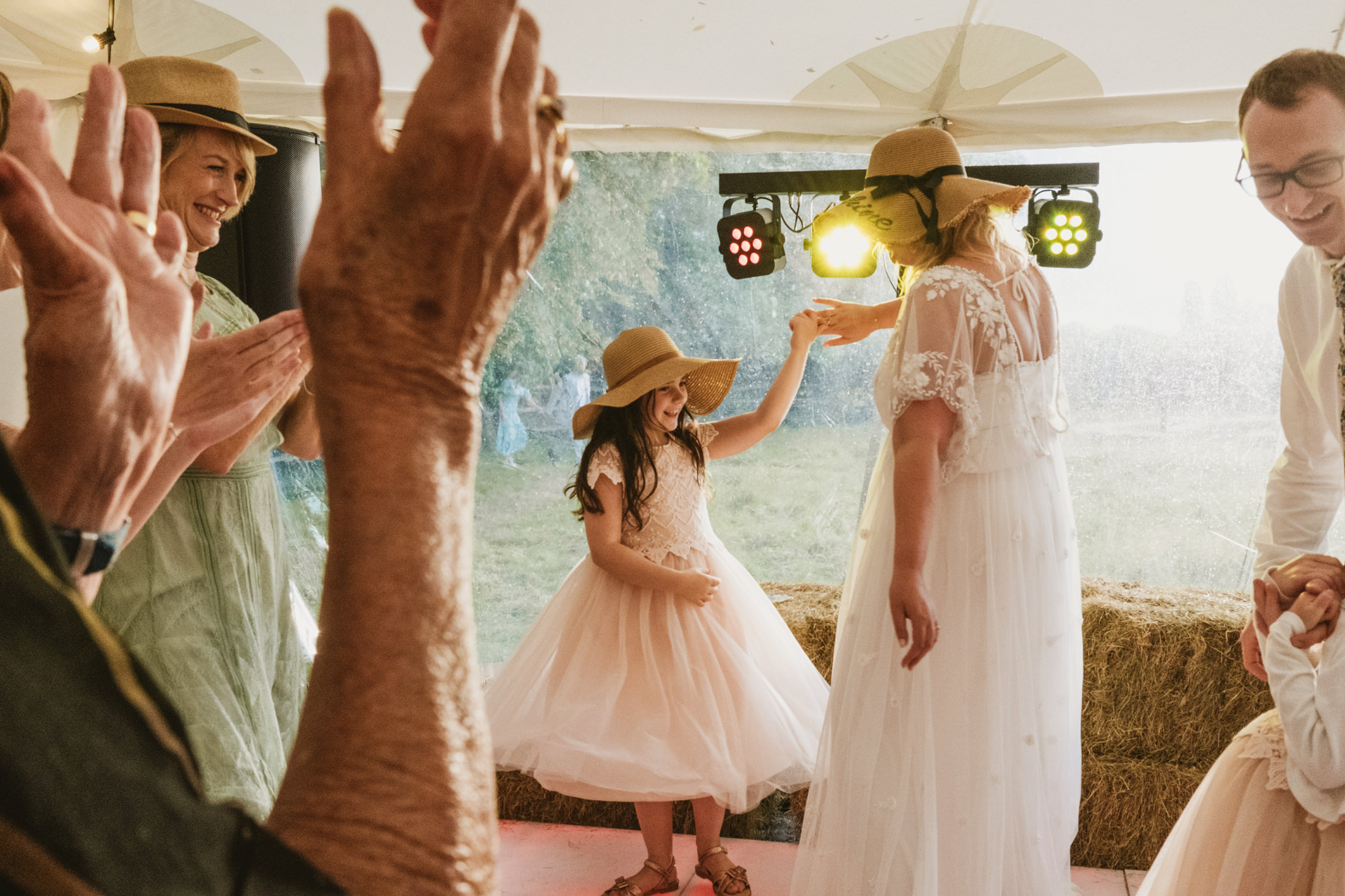 Guests celebrating at a summer wedding reception.