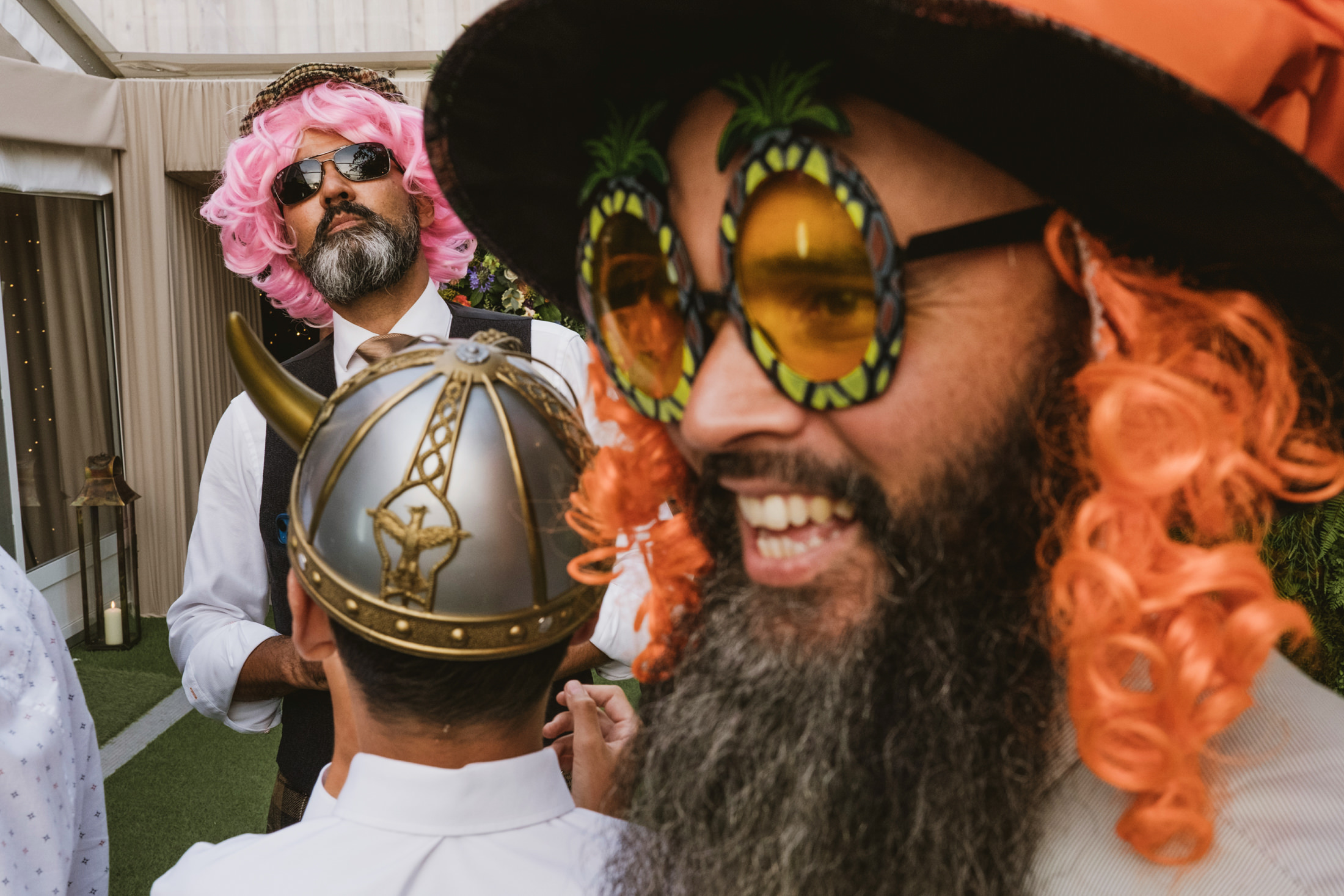 Men in costumes and wigs at a party