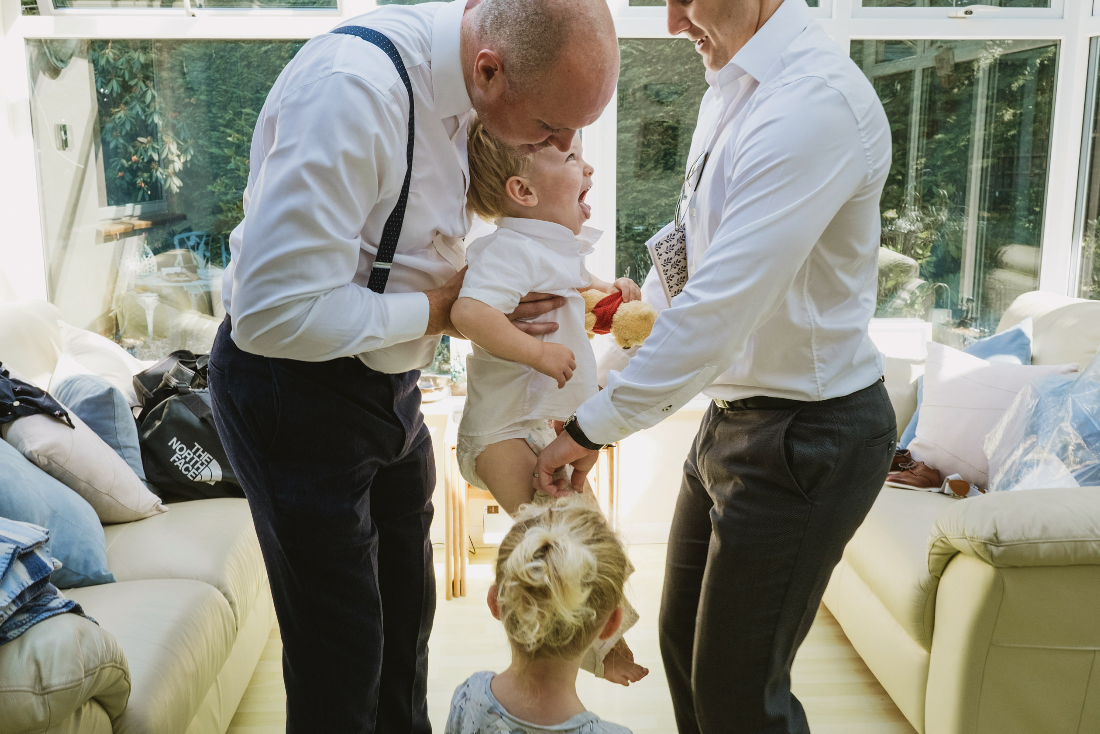 Family playing with children in living room