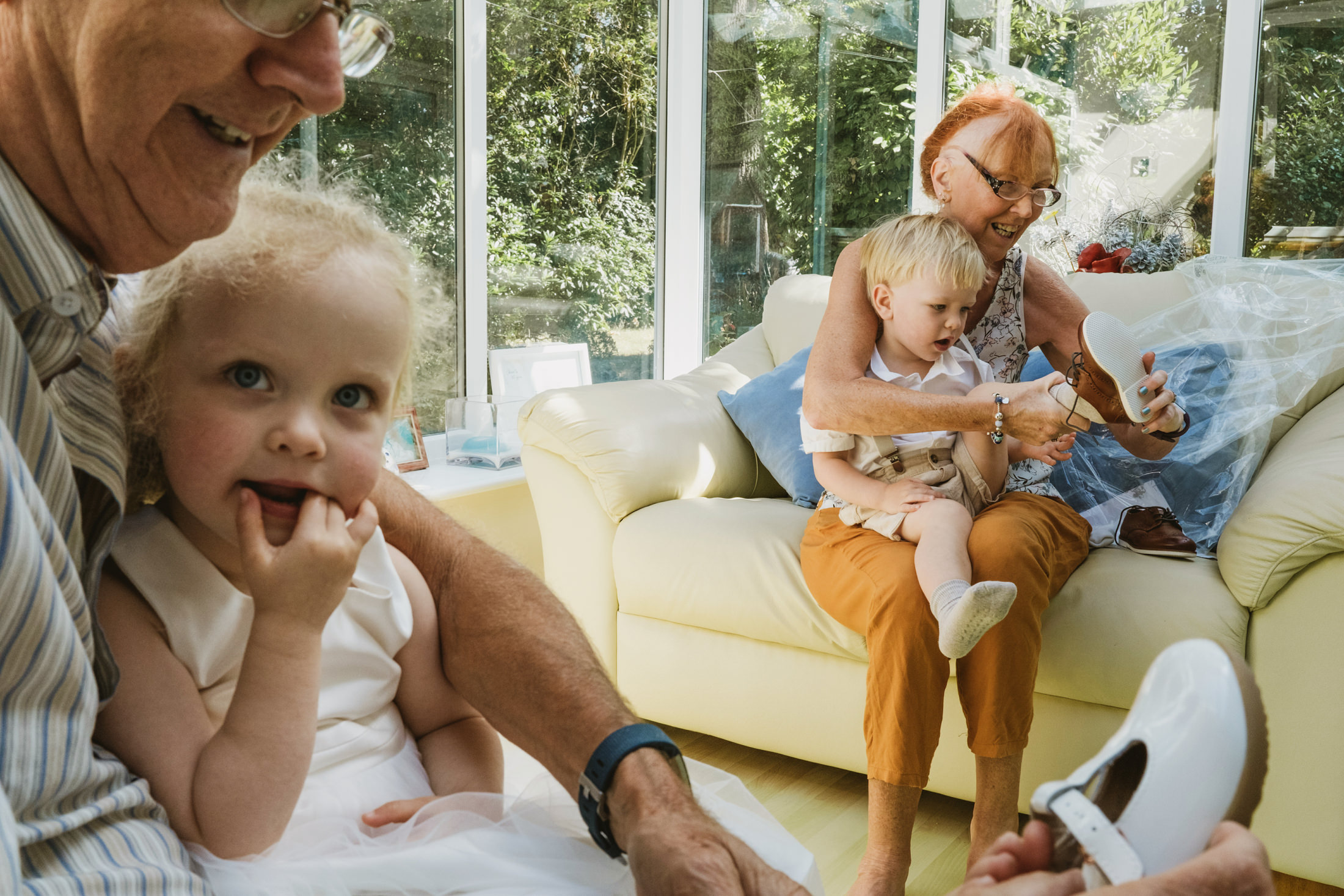 Documentary family photography at Riverside Marquee featuring unscripted moments with grandparents