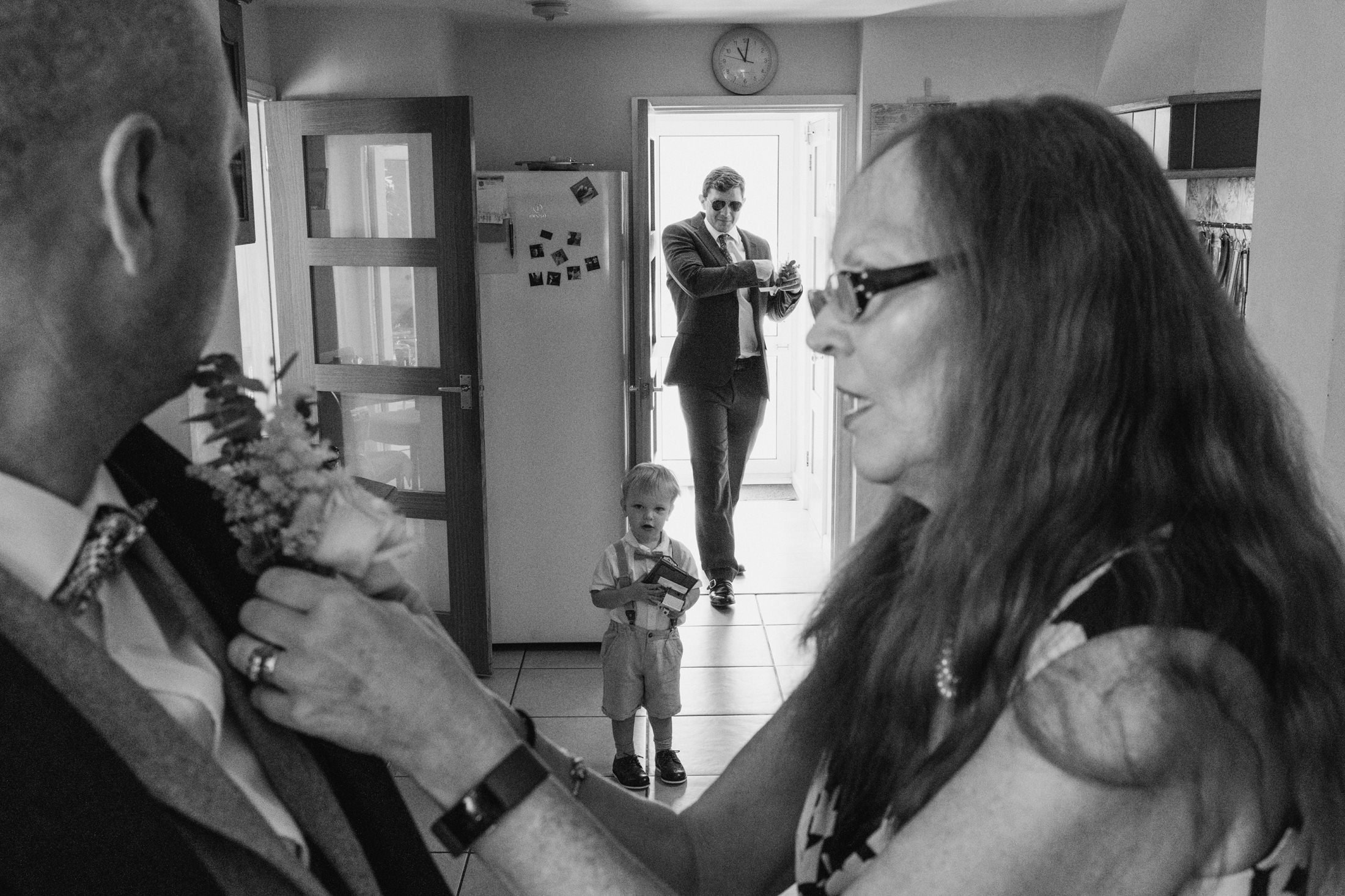 Family preparing for wedding ceremony indoors