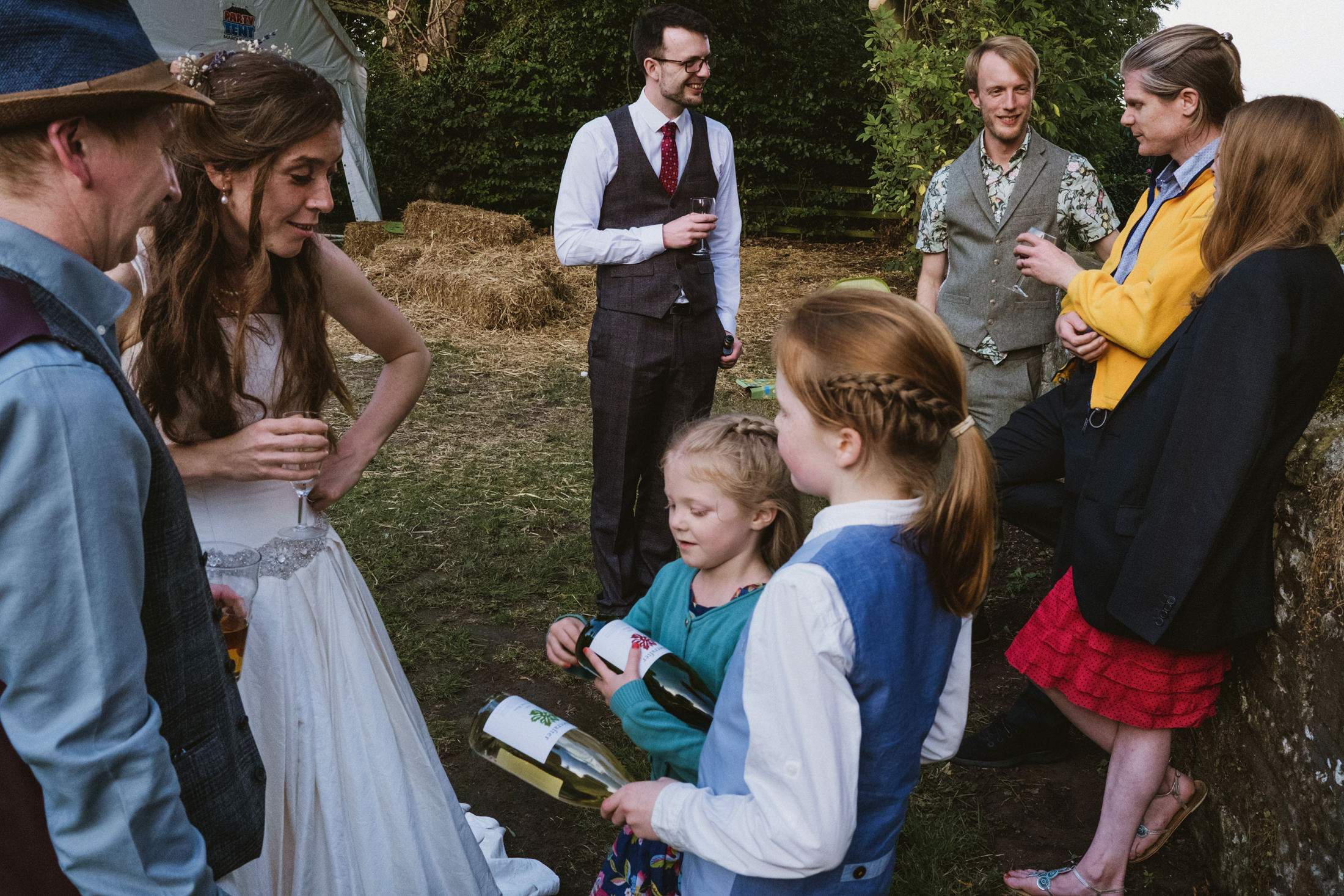 Group chatting at outdoor event with drinks