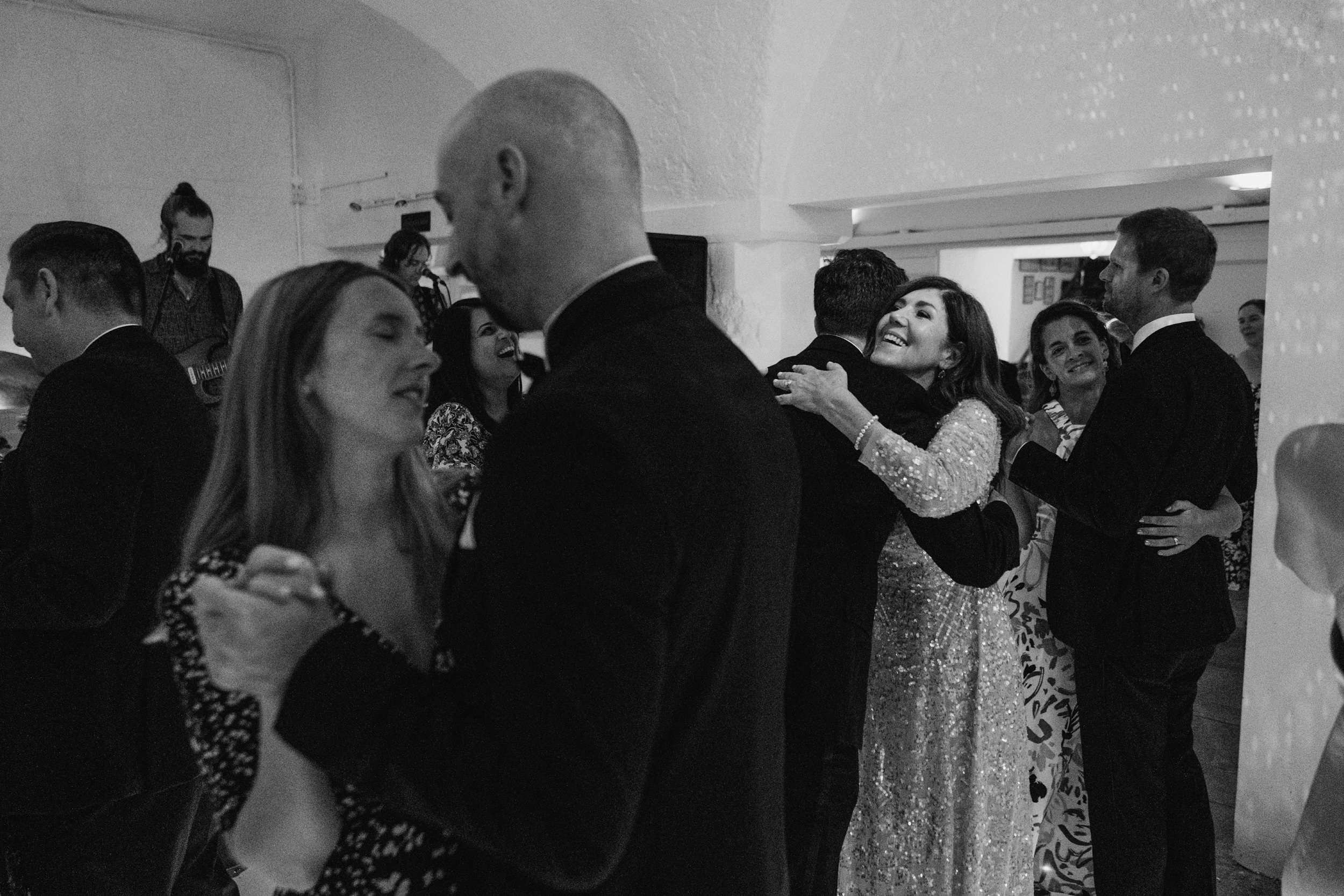 Guests dancing joyfully at a joyful wedding reception.