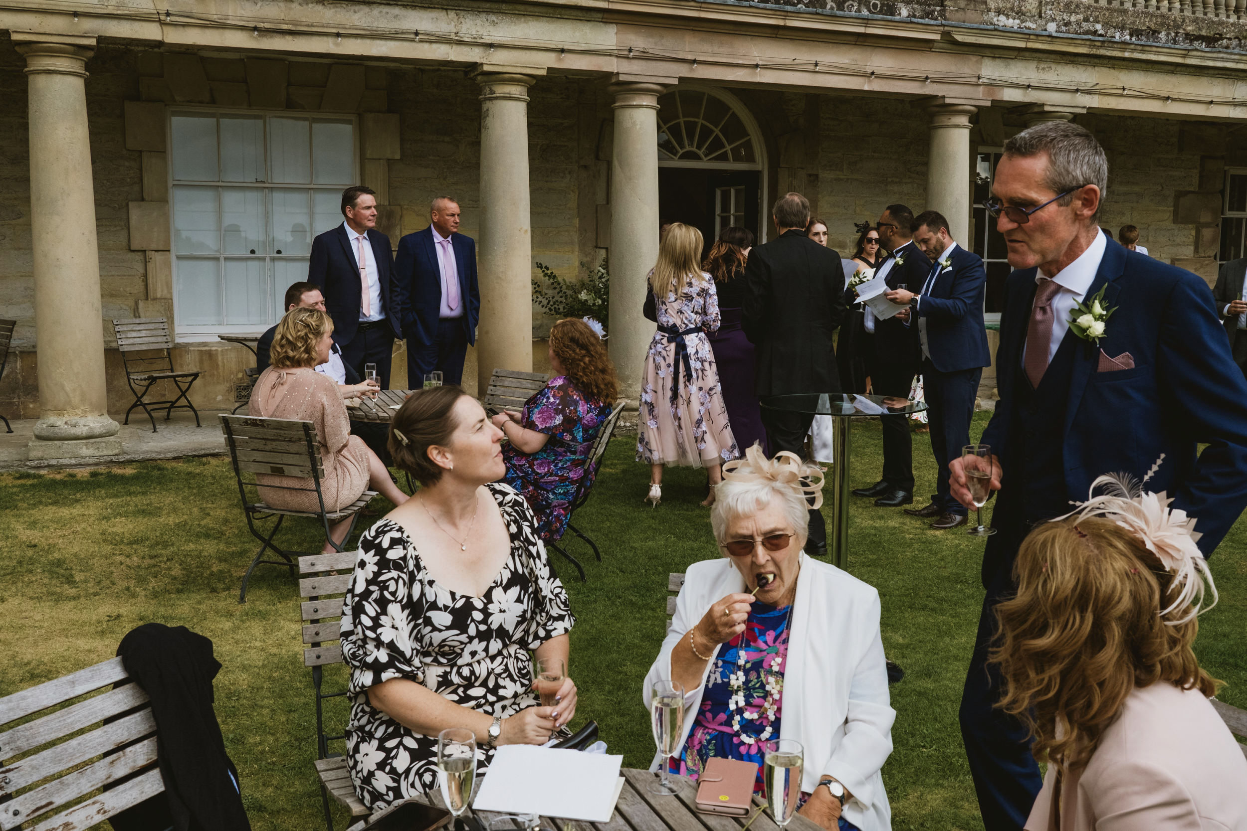 Guests socialising outdoors at wedding reception
