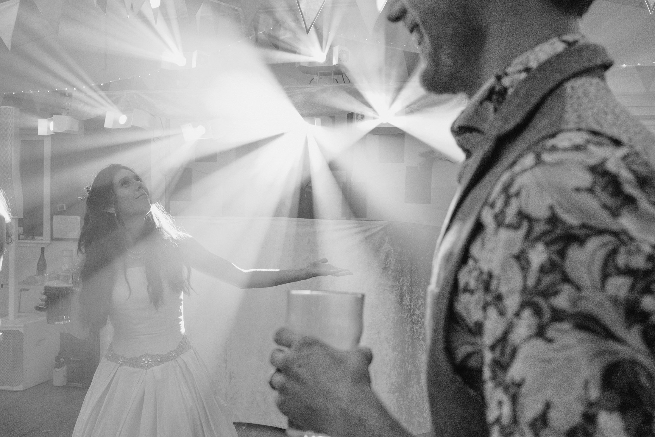 Bride and groom dancing at wedding reception.