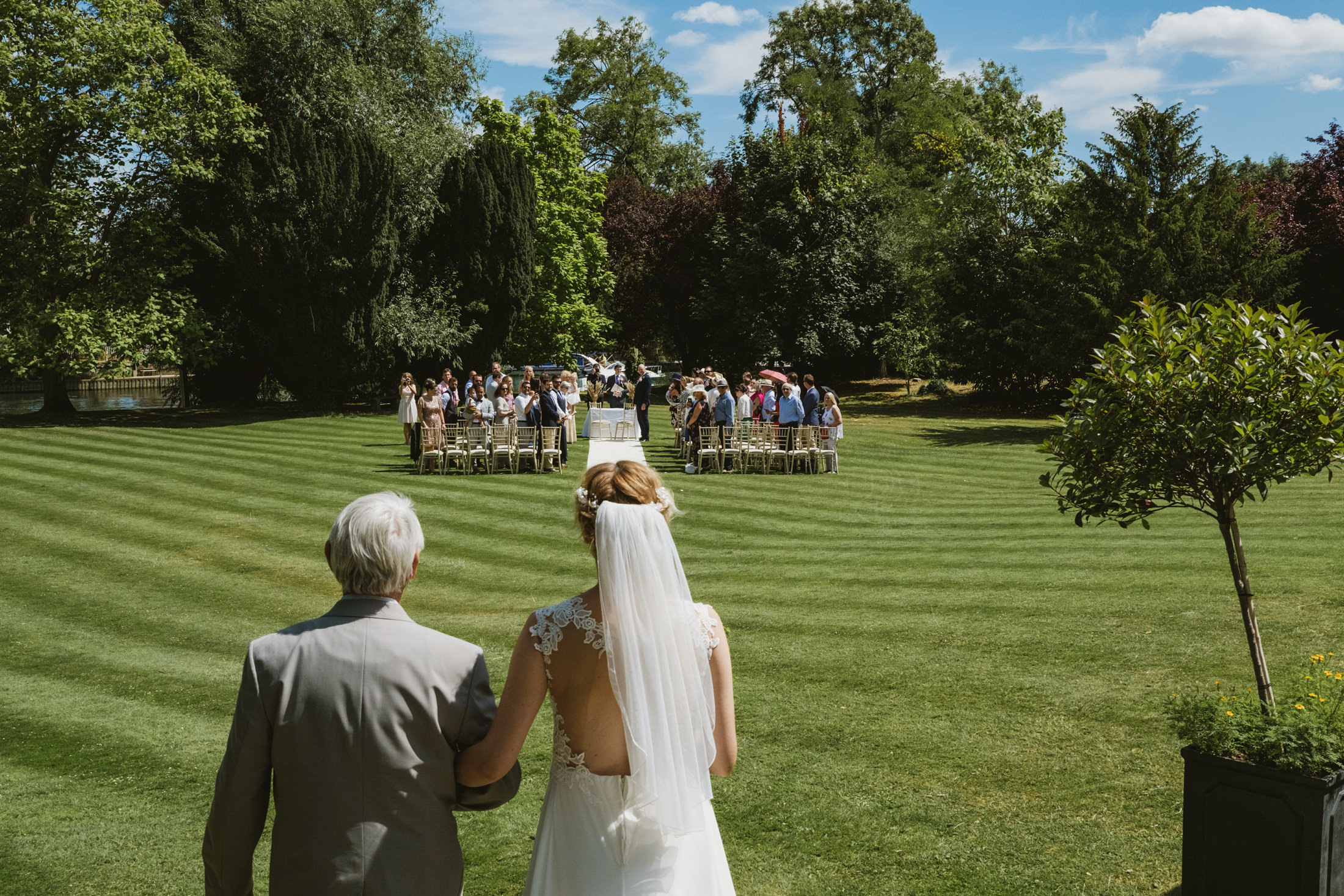 Bride walking down the aisle at outdoor wedding