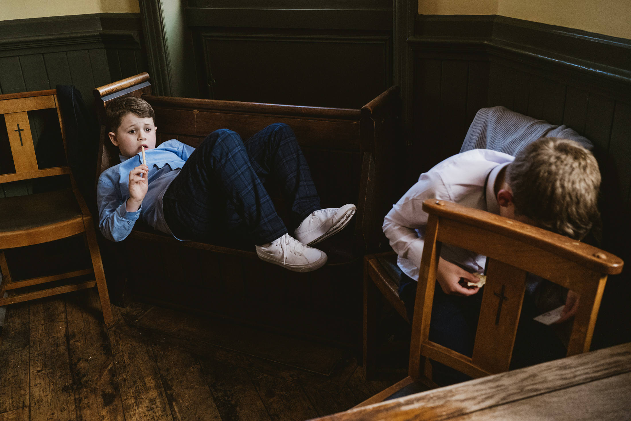 Bored boys in pub, one sitting, one lying down. A celebration of nothing; the unscripted transition between The Drapers Arms and The George & Monkey