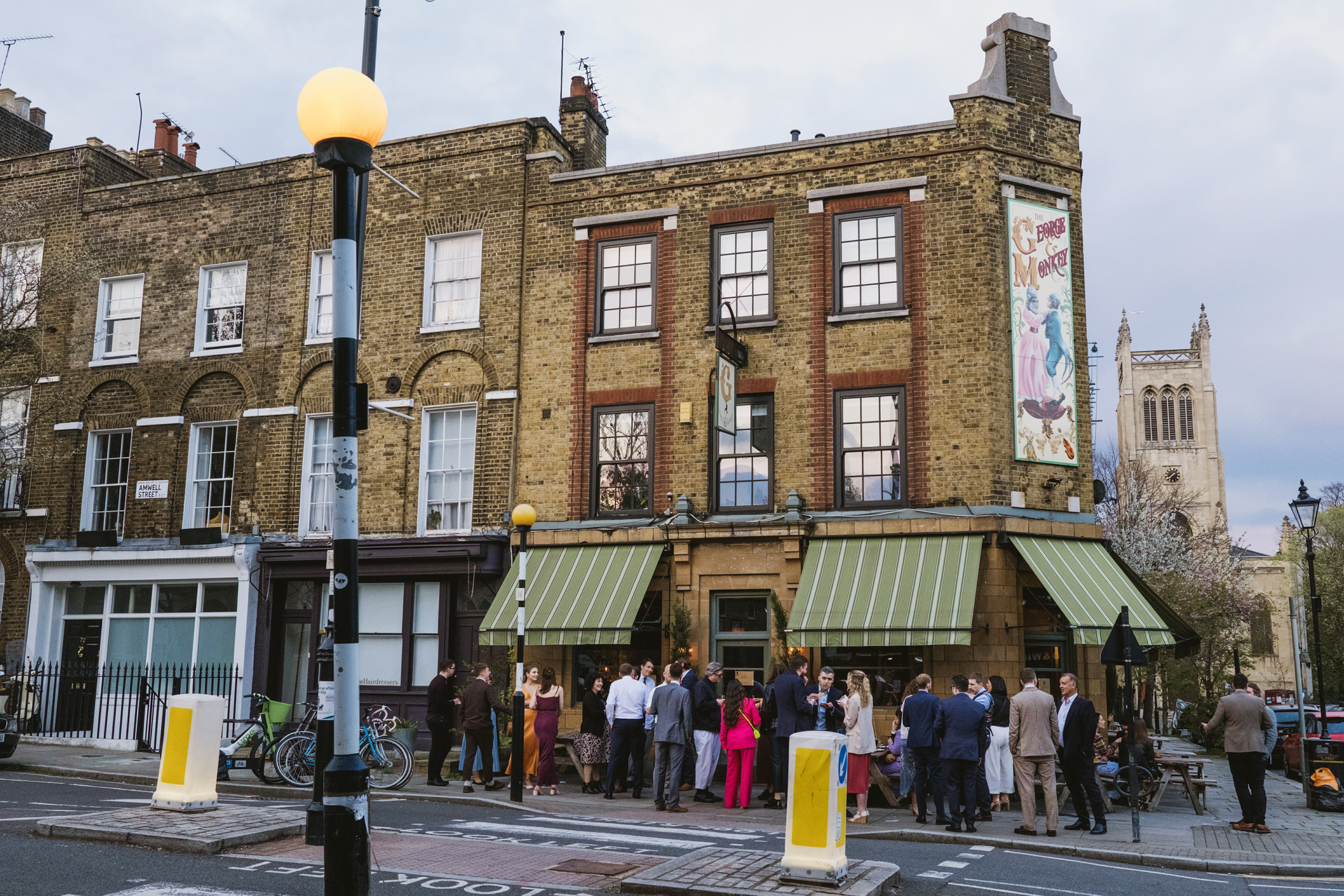 People gather outside London pub on Amwell Street