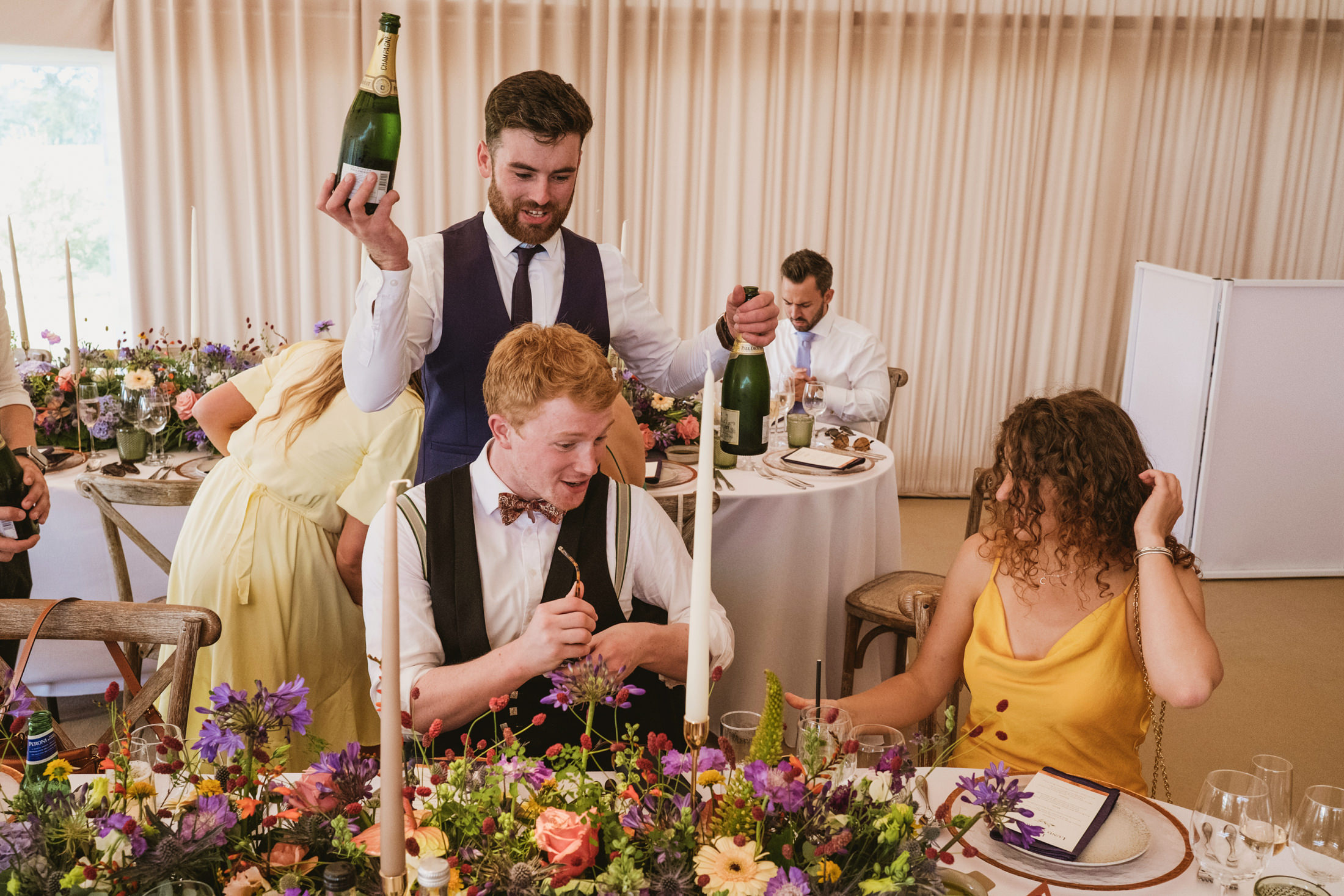 Guests celebrating with champagne at wedding reception