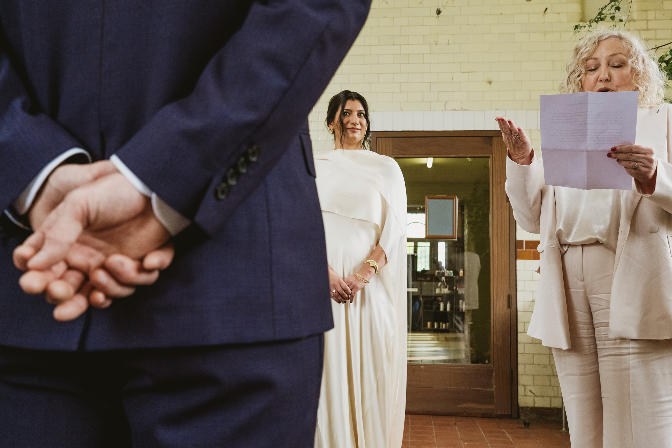 Wedding ceremony with couple and reader.
