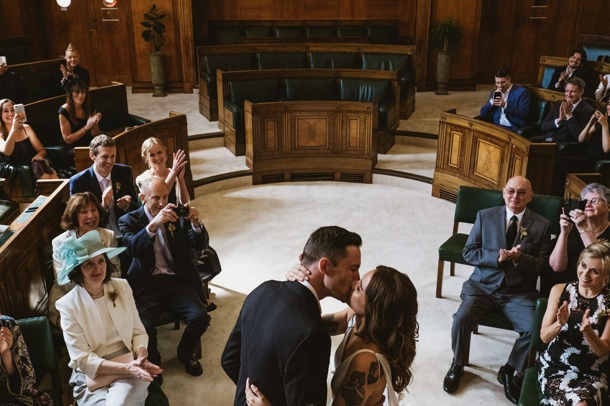 bride and groom first kiss at Town Hall Hotel